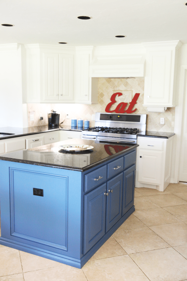 White kitchen with blue island